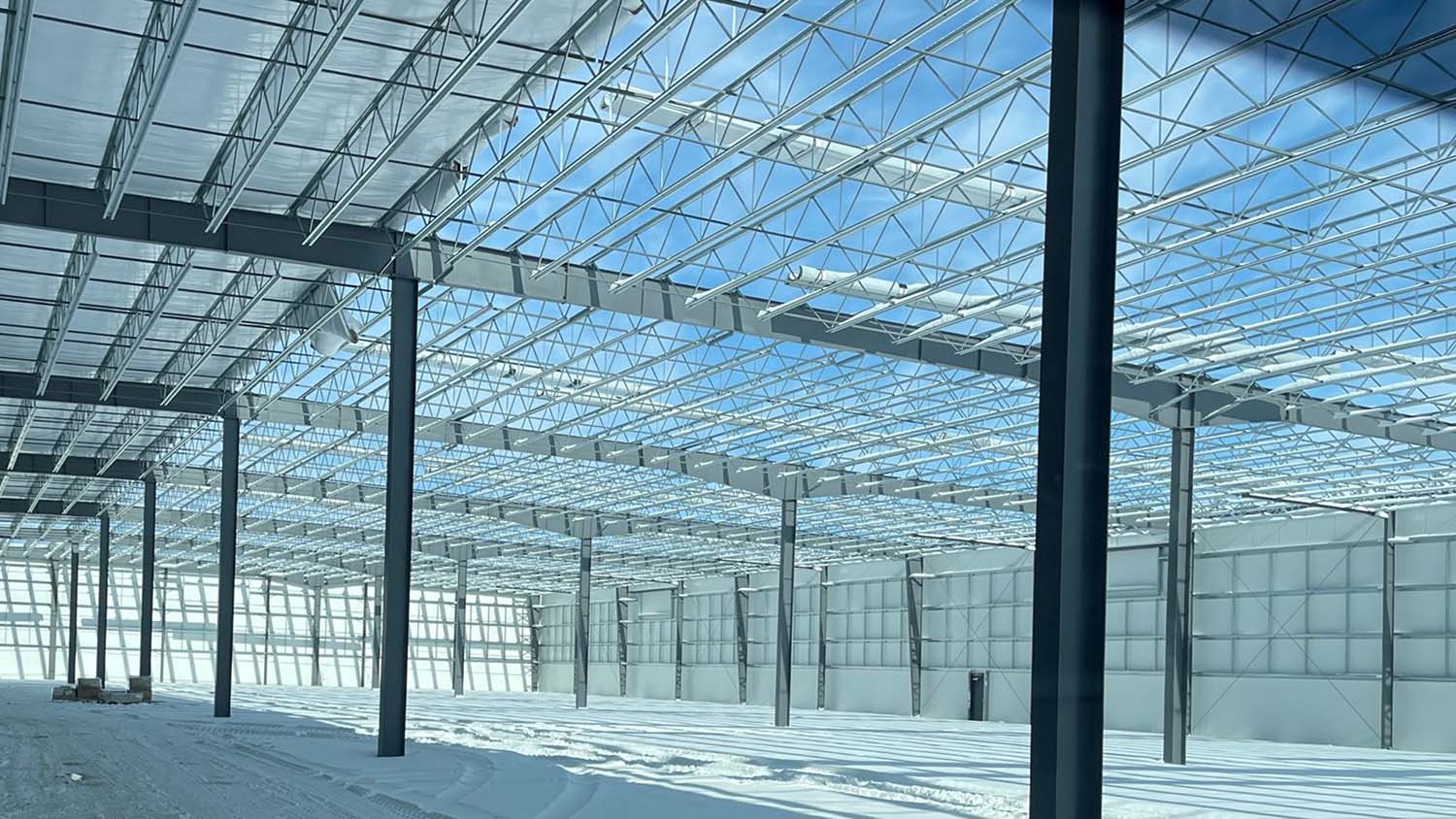 View of blue skies from inside Trim-Lok Midwest construction site